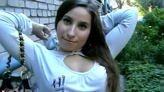 Brunette teen with natural tits is giving deep blowjob outdoors